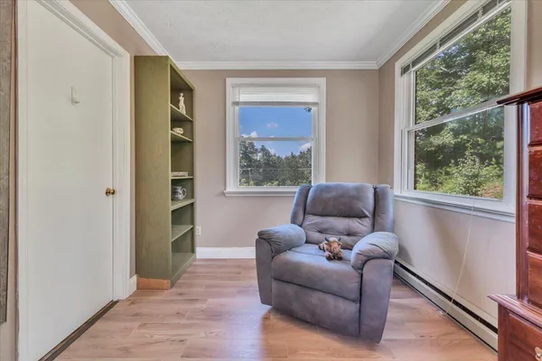 a bathroom with a granite countertop toilet sink and mirror