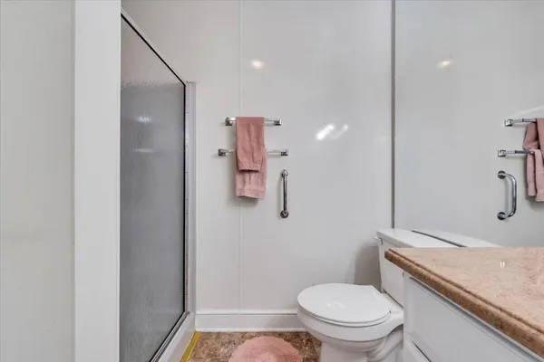 a bedroom with bed and a window