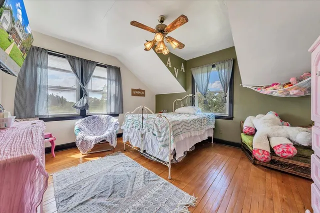a bathroom with a sink toilet and window