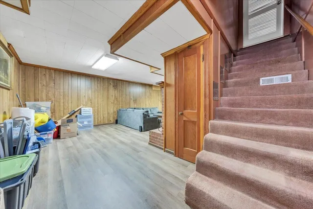 a view of a living room kitchen and a wooden floor