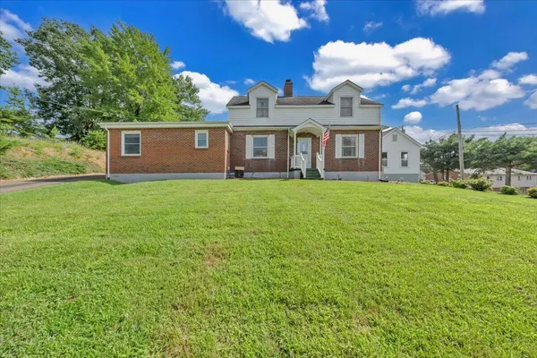 an aerial view of a house with swimming pool