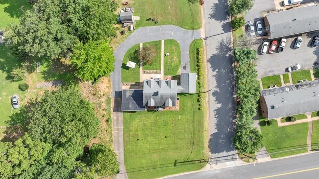 an aerial view of a residential houses with outdoor space