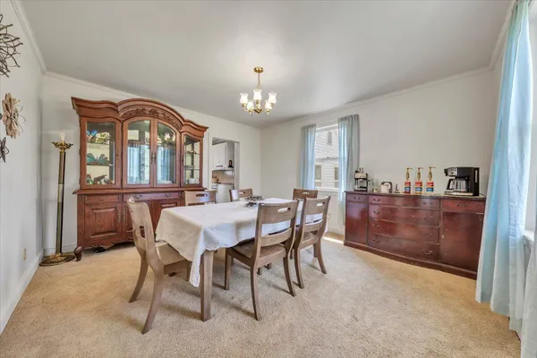 a view of a dining room with furniture window and outside view