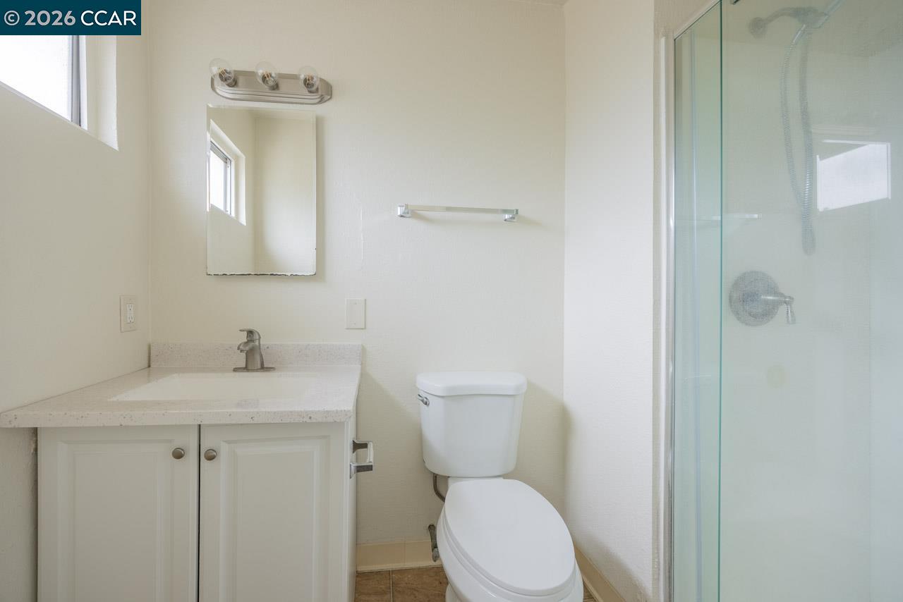 6118 Rutland Drive Carmichael, CA 95608 - Photo 12 of 19 a white toilet sitting next to a bathroom sink