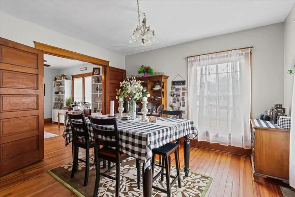a bedroom with a bed and a ceiling fan