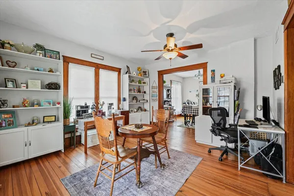 a view of a livingroom with furniture window and wooden floor