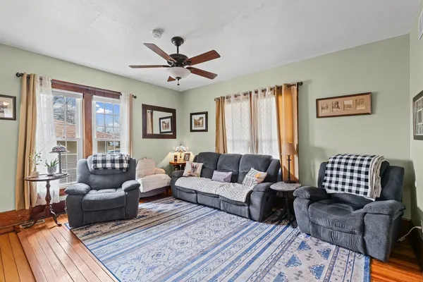 a kitchen with stainless steel appliances granite countertop a refrigerator a stove and a sink