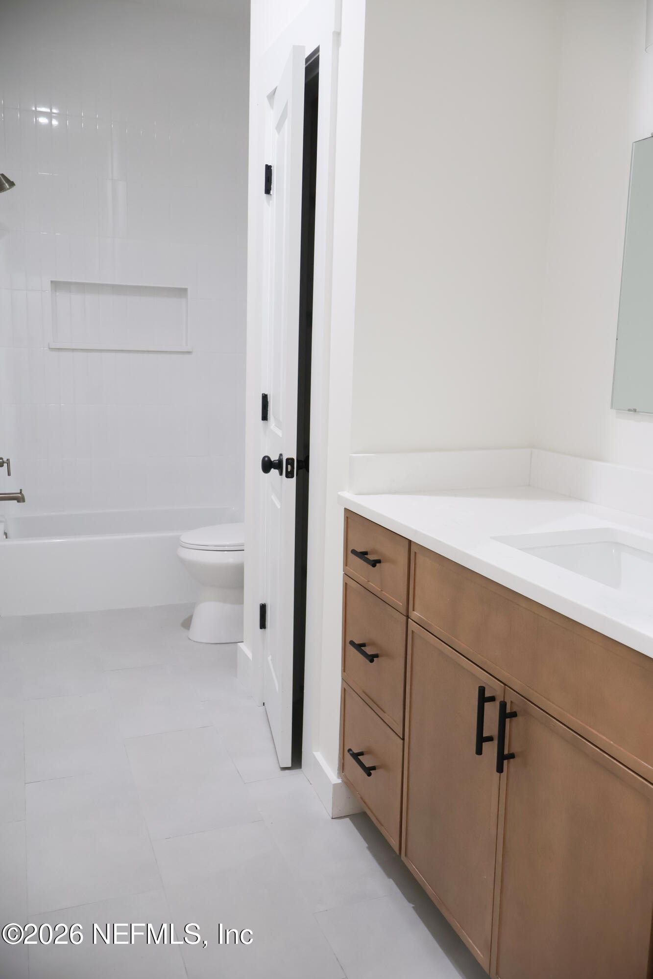 261121 Rowe Road Hilliard, FL 32046 - Photo 27 of 33 a bathroom with a shower a toilet and a sink