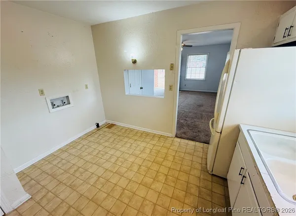 a bathroom with a sink a mirror and a shower