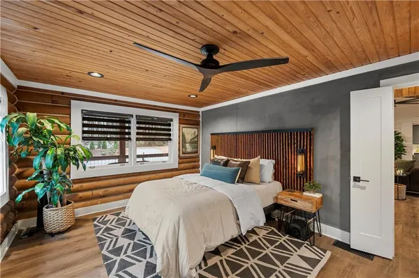 a bedroom with furniture and a window