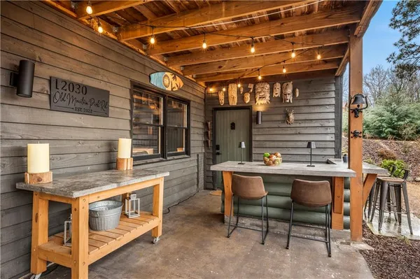 a view of a chairs and table in the patio