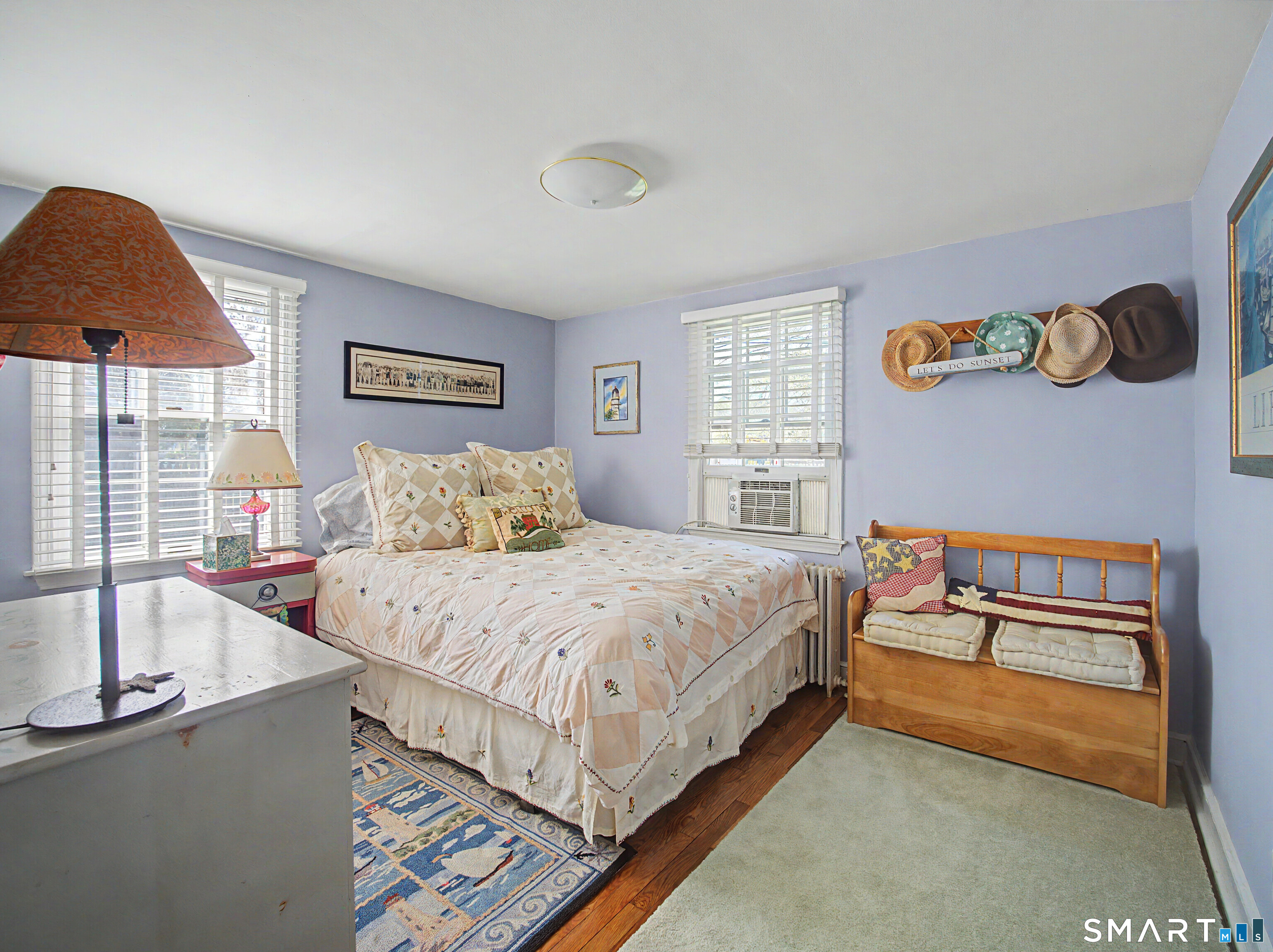 173 Puritan Road Fairfield, CT 06824 - Photo 14 of 19 a bedroom with a bed and a dresser with the shoe rack