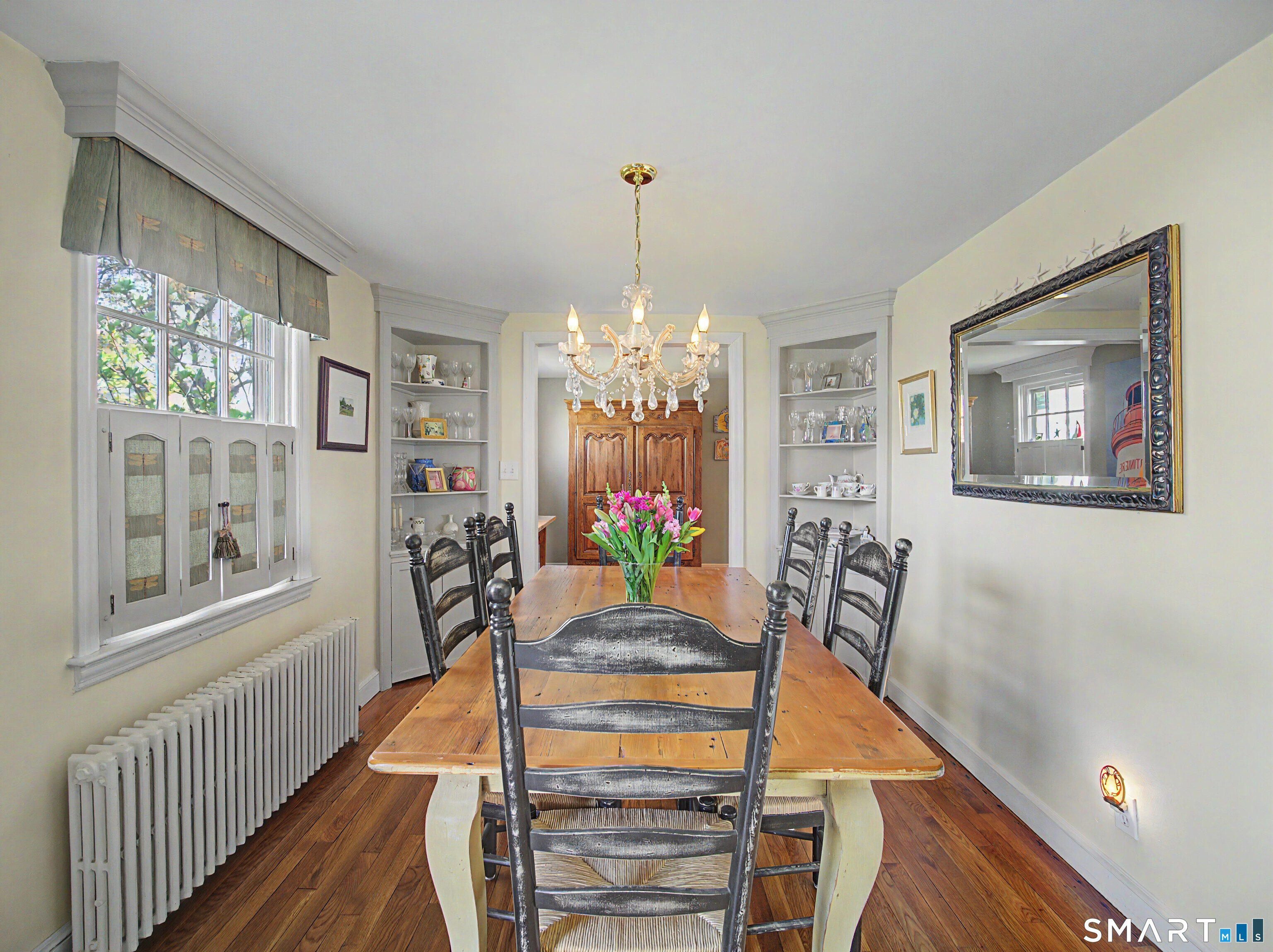 173 Puritan Road Fairfield, CT 06824 - Photo 5 of 19 a view of a dining room with furniture window and wooden floor
