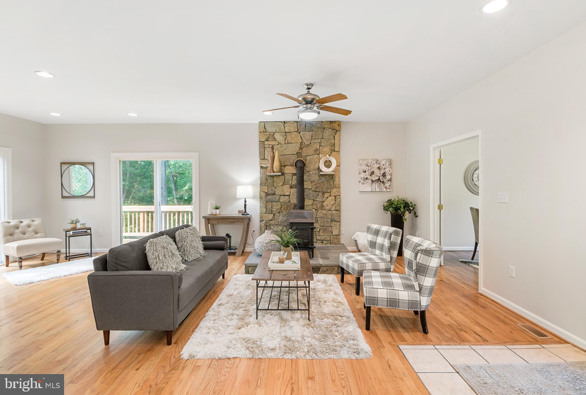 3533 Hopeland Road Frederick, MD 21704 - Photo 6 of 81 Living room with stone accent wood stove