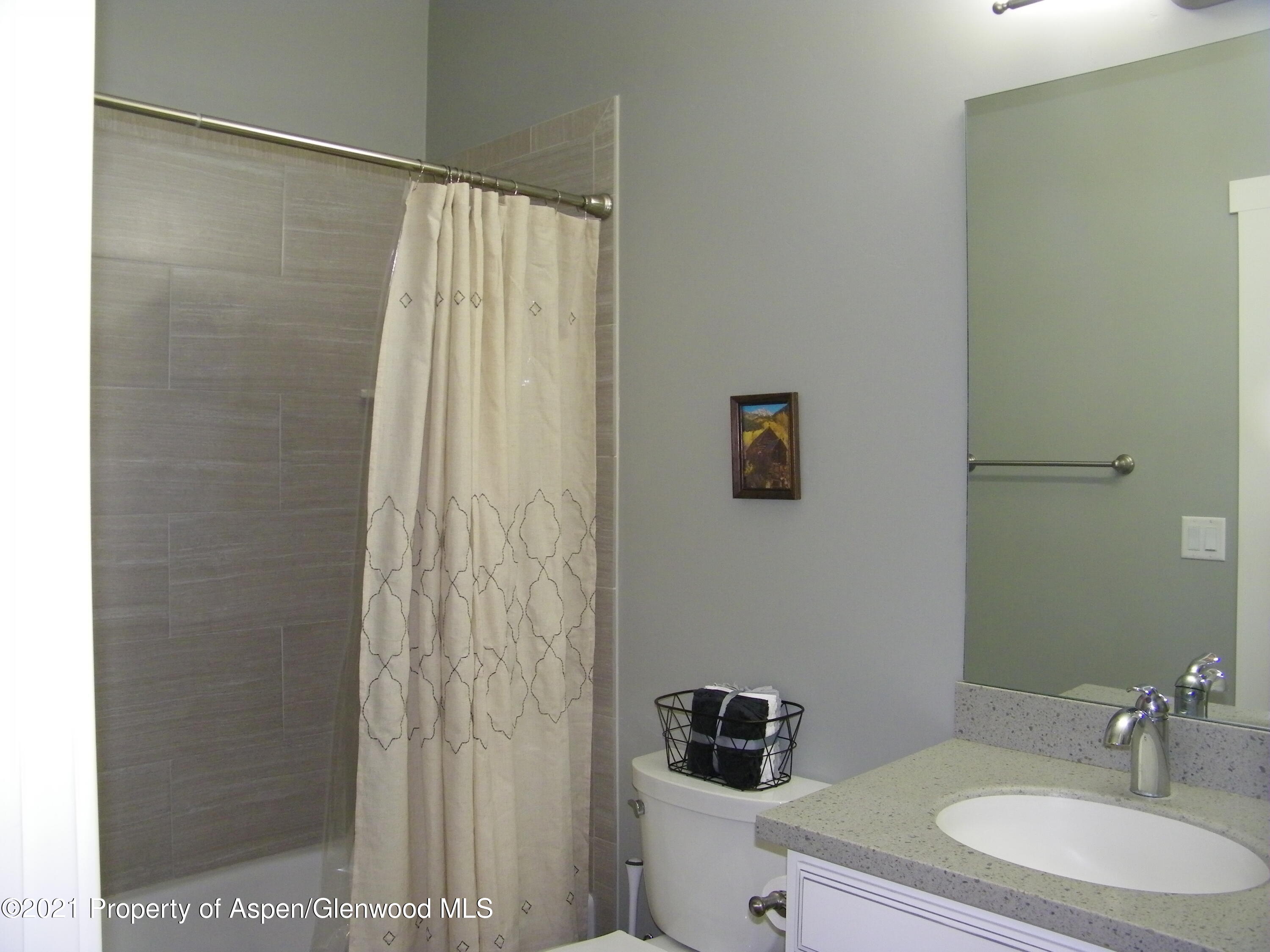 1717 Belgian Loop Silt, CO 81652 - Photo 12 of 16 a bathroom with a sink and a mirror
