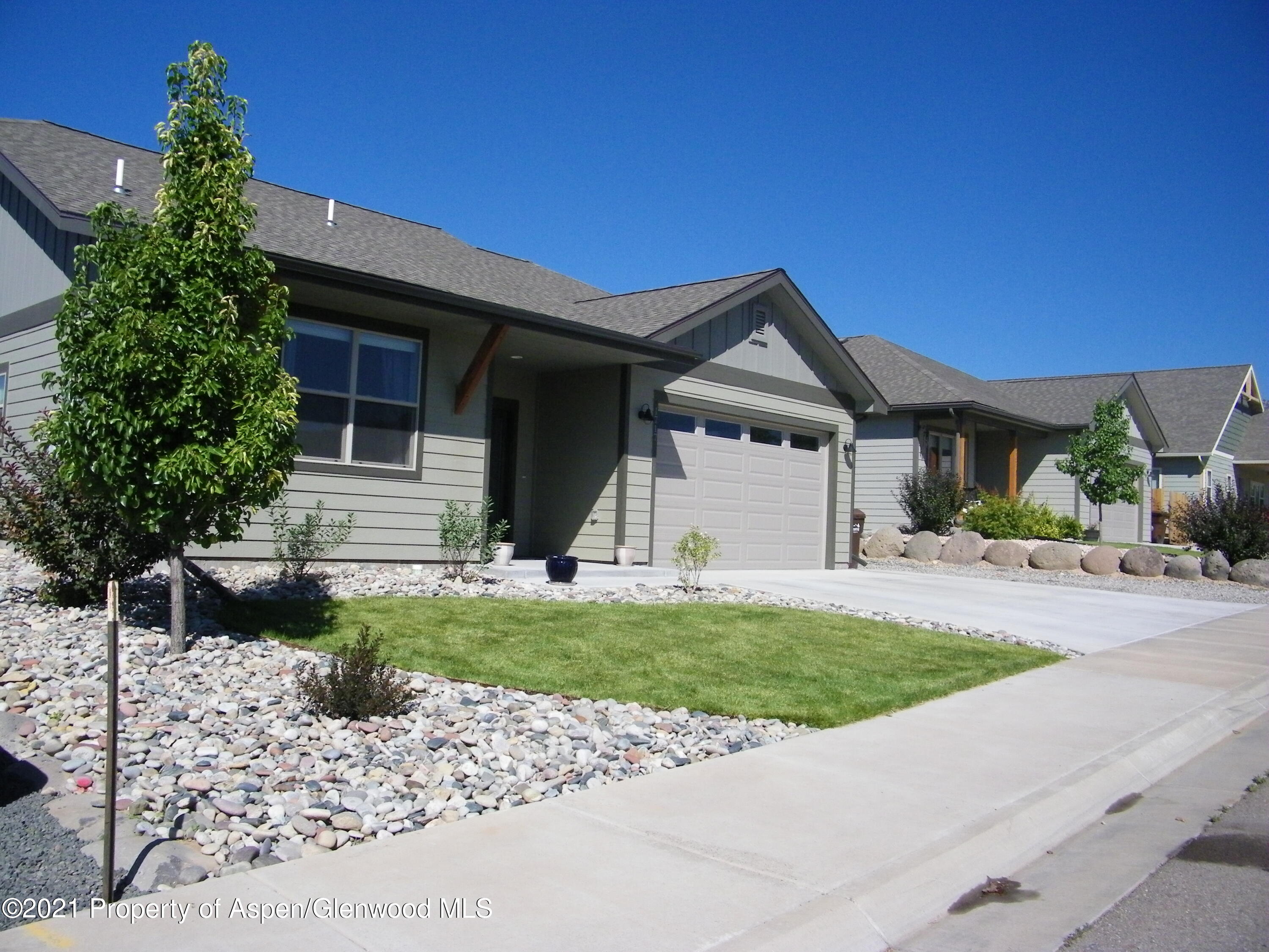 1717 Belgian Loop Silt, CO 81652 - Photo 2 of 16 a front view of a house with a garden and yard