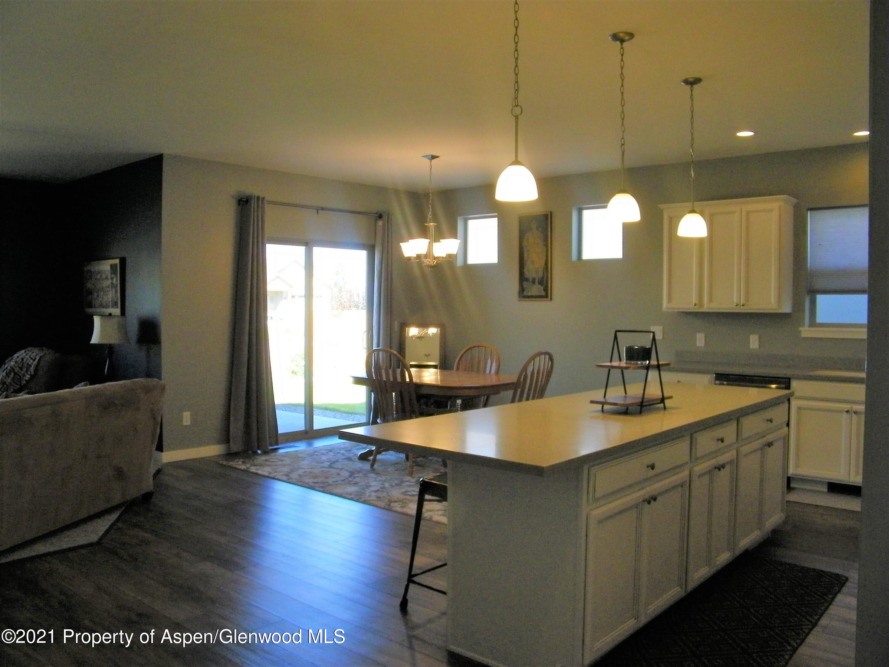 1717 Belgian Loop Silt, CO 81652 - Photo 5 of 16 a kitchen with a sink cabinets and wooden floor