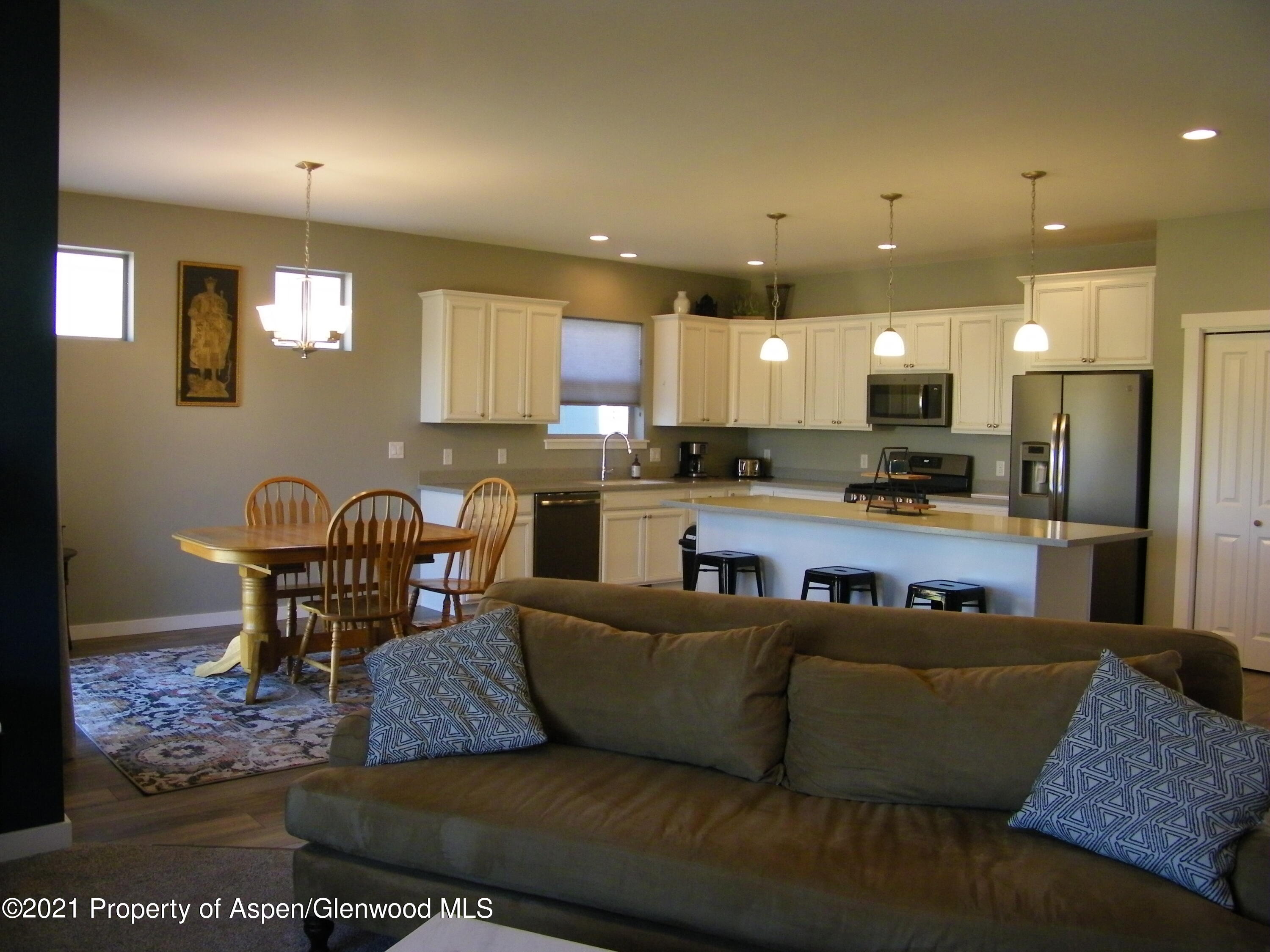 1717 Belgian Loop Silt, CO 81652 - Photo 6 of 16 a living room with furniture and kitchen view