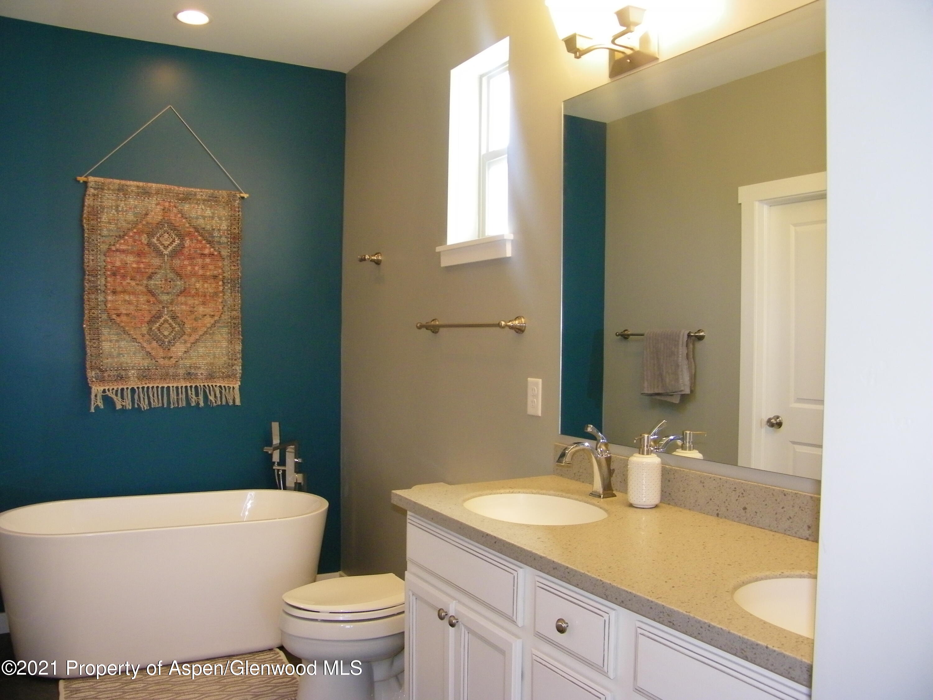 1717 Belgian Loop Silt, CO 81652 - Photo 9 of 16 a bathroom with a granite countertop sink a toilet and a bathtub