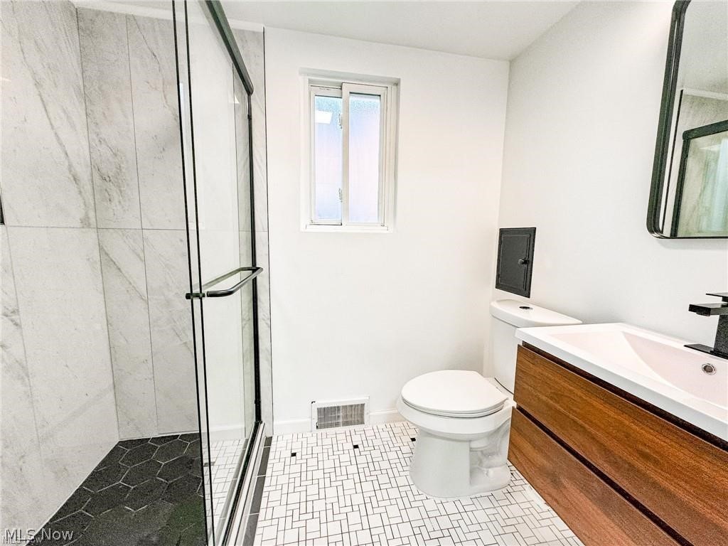2907 Snow Road, Unit UP Cleveland, OH 44134 - Photo 8 of 19 Bathroom with vanity and a stall shower
