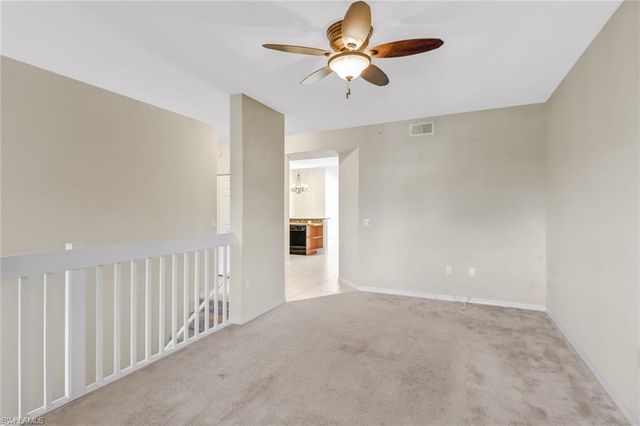 a view of a livingroom with a ceiling fan