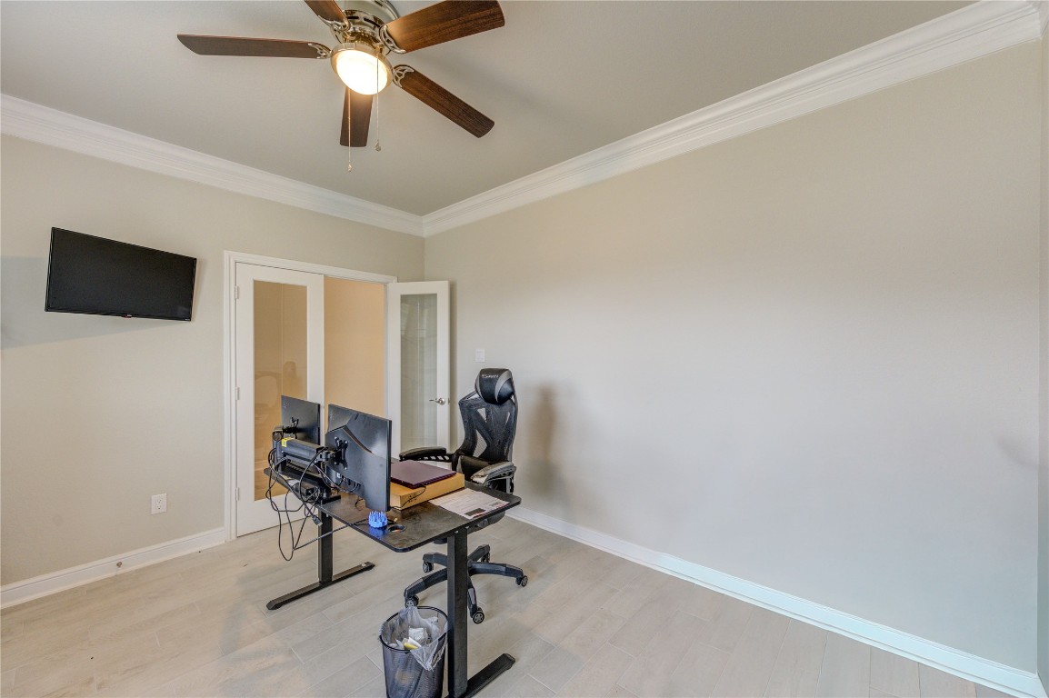 2910 Knotty Frst Drive Spring, TX 77373 - Photo 18 of 20 a view of a workspace with furniture and a window