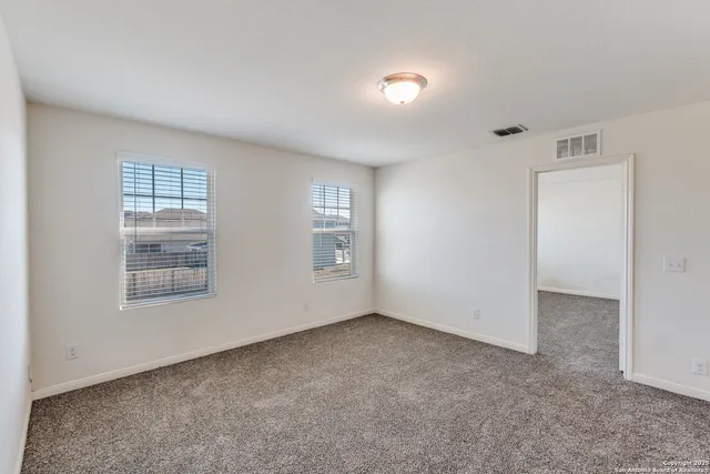 an empty room with windows