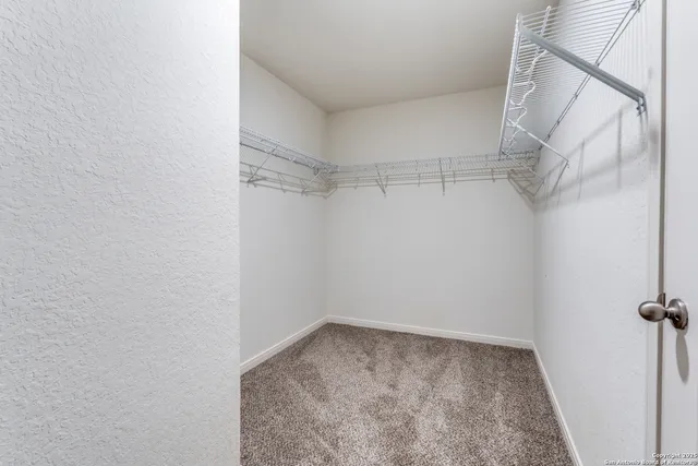 a view of a room with racks on the wall