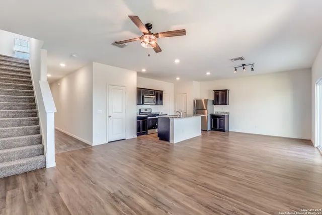 a view of kitchen with cabinets and wooden floor