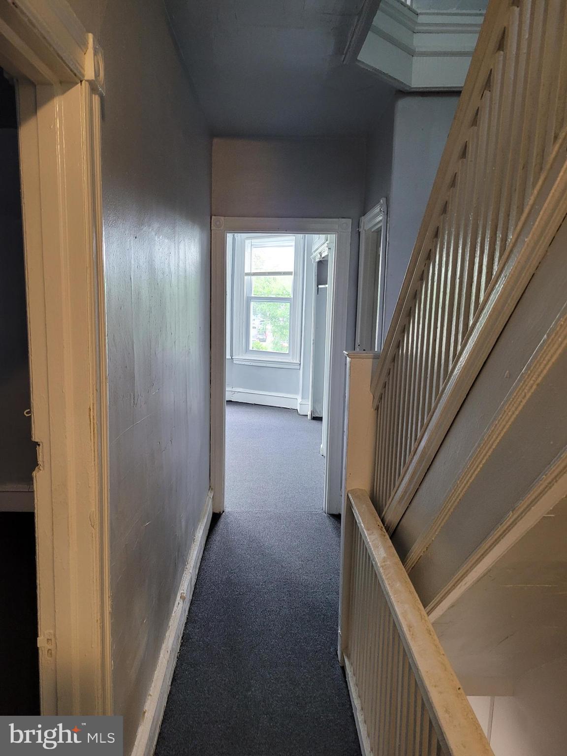 1422 Blavis Street Philadelphia, PA 19140 - Photo 13 of 20 a view of a hallway with wooden floor and stairs