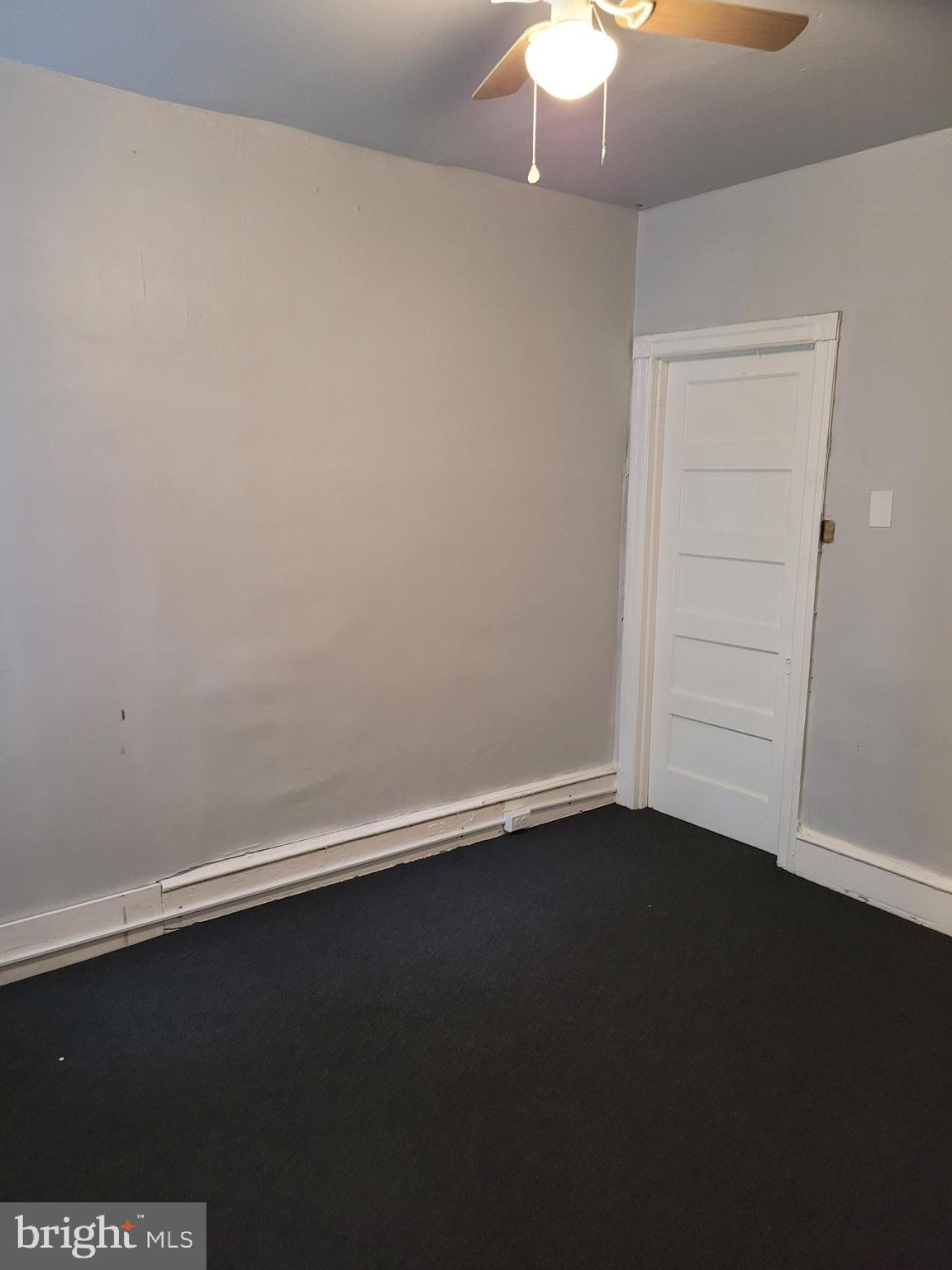 1422 Blavis Street Philadelphia, PA 19140 - Photo 14 of 20 an empty room with a wooden floor and a window