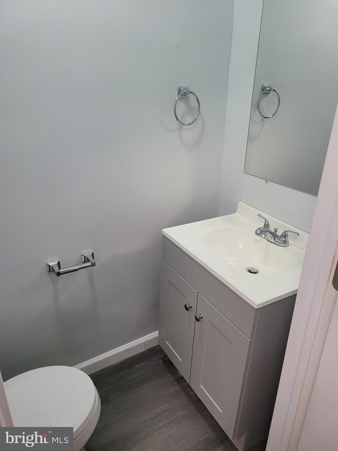 1422 Blavis Street Philadelphia, PA 19140 - Photo 17 of 20 a bathroom with a sink mirror and toilet