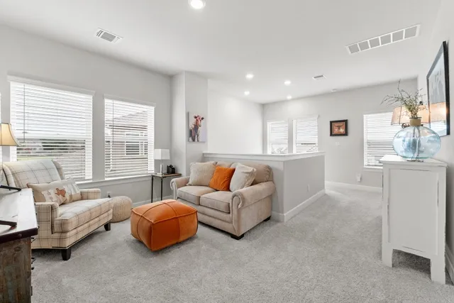 a spacious bedroom with a bed and a couch