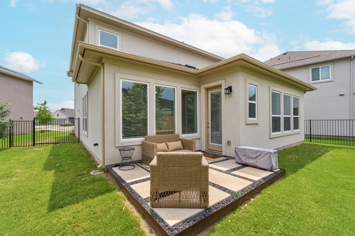 144 Monterey Oak Trail Georgetown, TX 78628 - Photo 23 of 28 a view of a house with backyard and porch