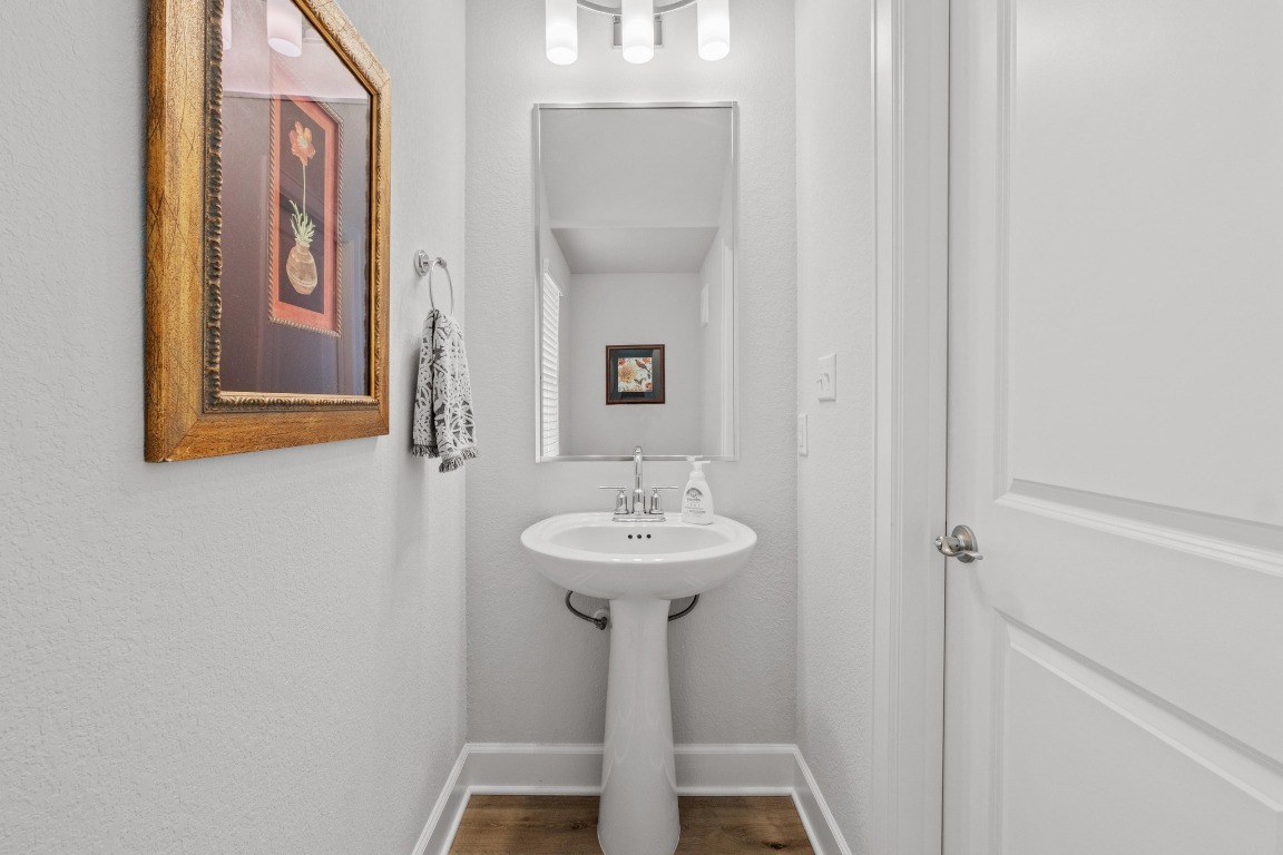 144 Monterey Oak Trail Georgetown, TX 78628 - Photo 9 of 28 a bathroom with a sink and a mirror