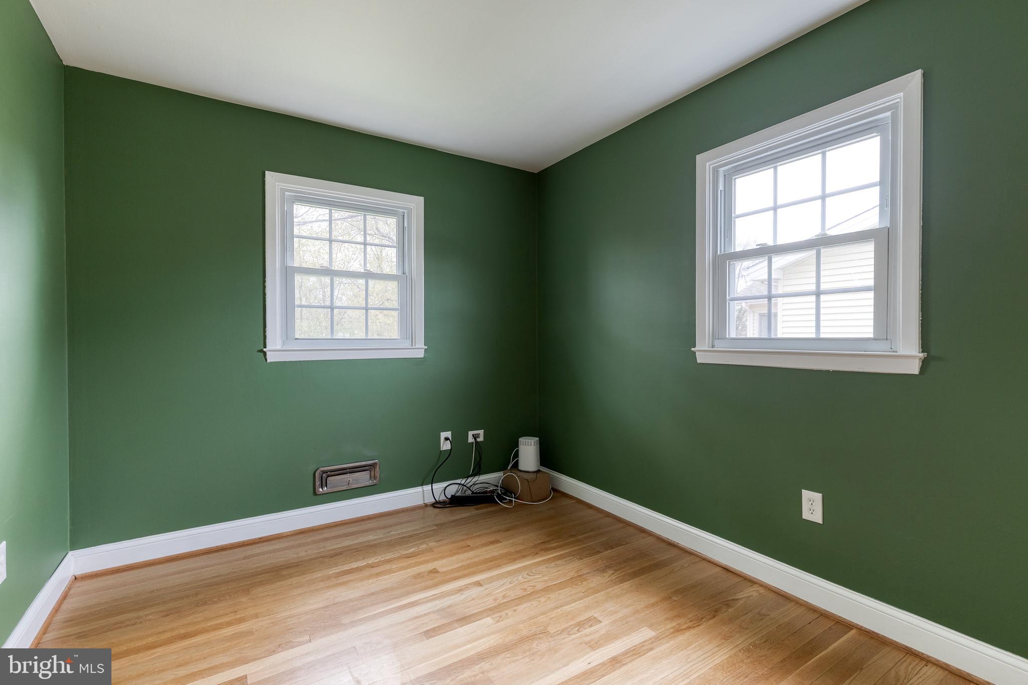 1302 Black Friars Road Baltimore, MD 21228 - Photo 17 of 38 a view of a room with wooden floor and windows