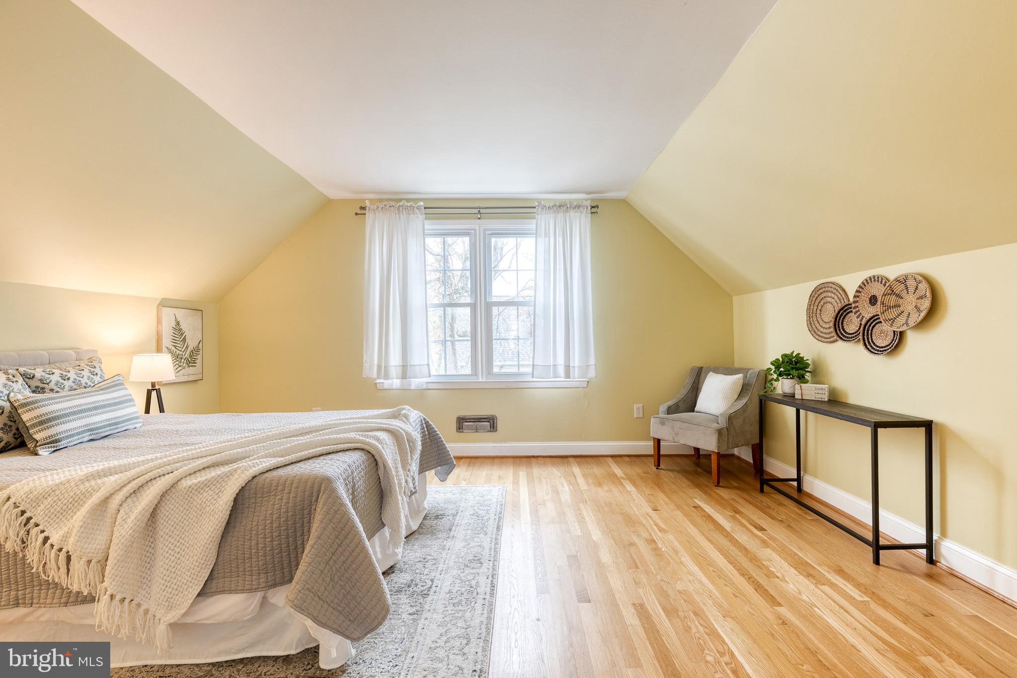 1302 Black Friars Road Baltimore, MD 21228 - Photo 20 of 38 a spacious bedroom with a bed and wooden floor