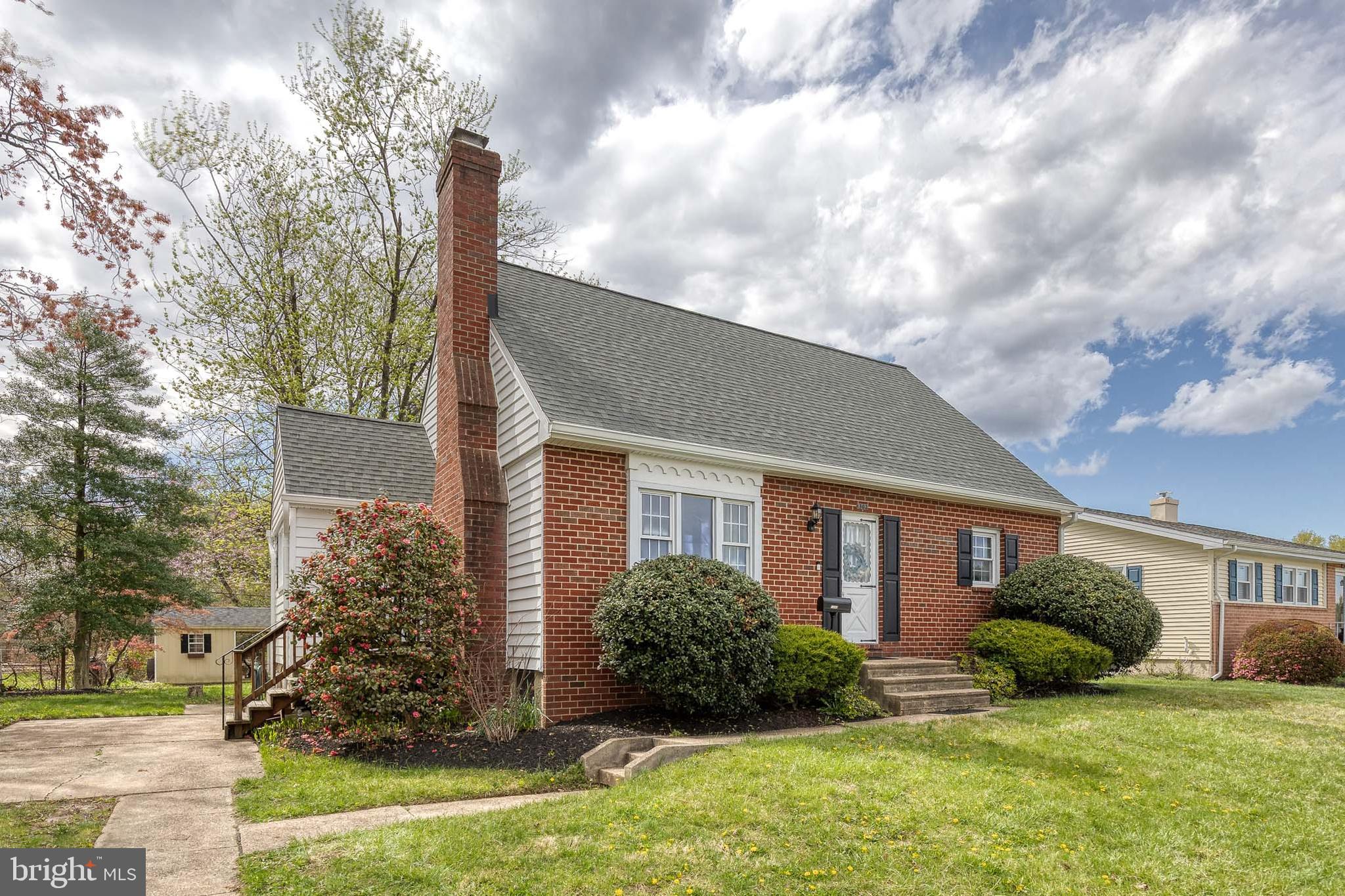 1302 Black Friars Road Baltimore, MD 21228 - Photo 2 of 38 a view of a house with backyard and a tree