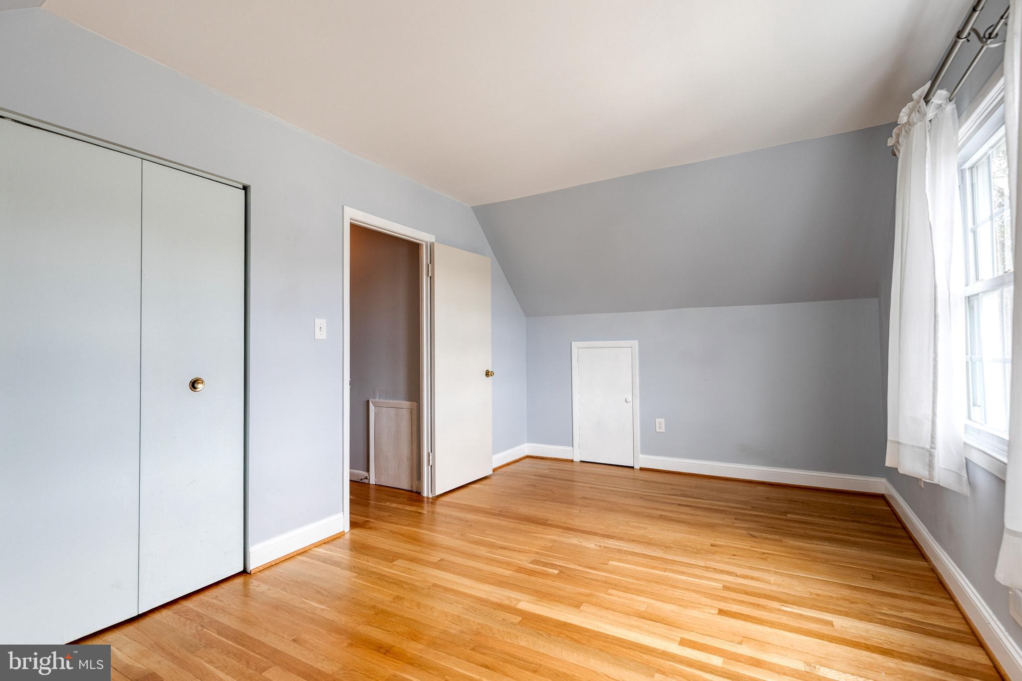1302 Black Friars Road Baltimore, MD 21228 - Photo 24 of 38 a view of empty room with wooden floor and fan