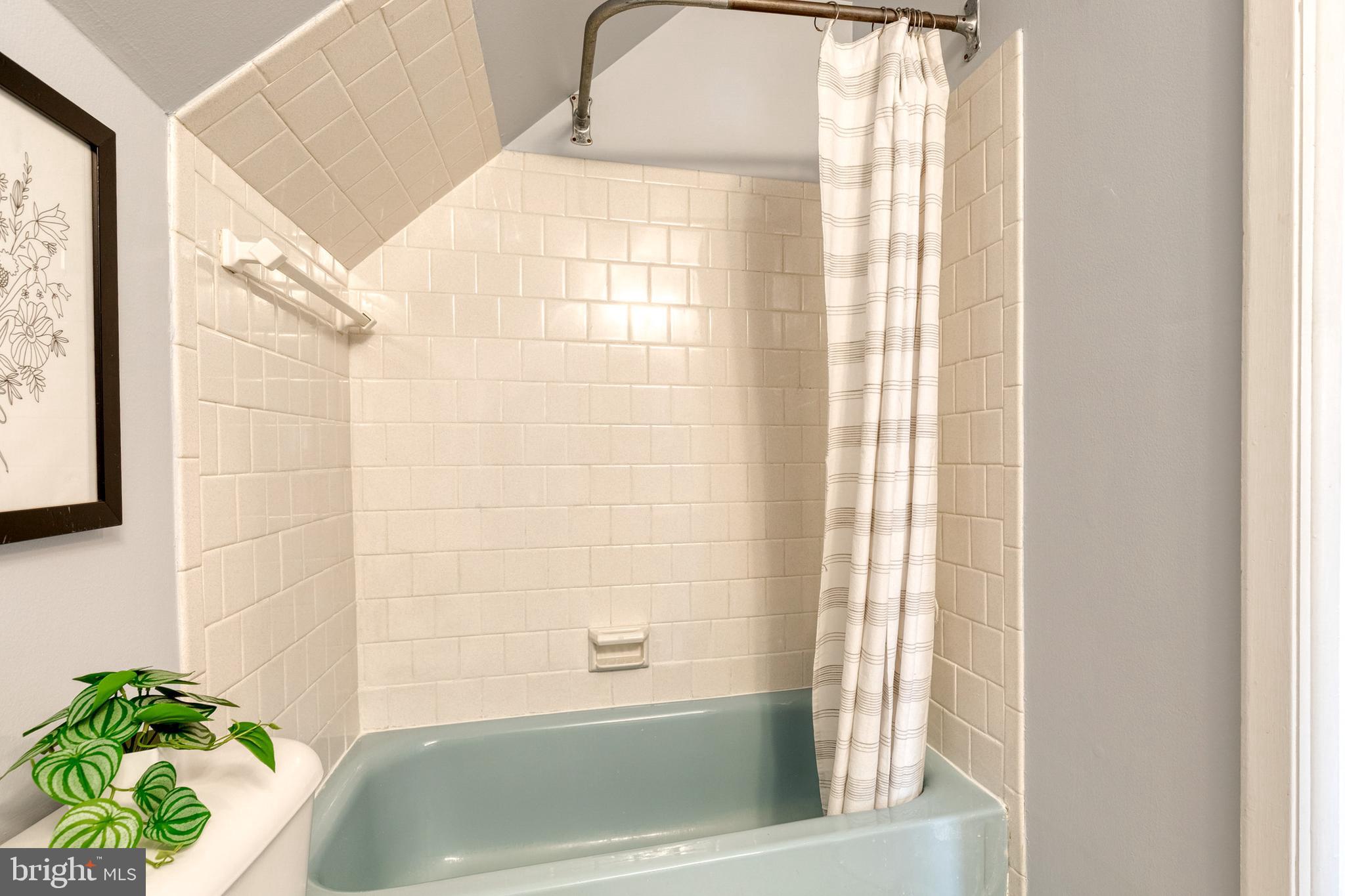 1302 Black Friars Road Baltimore, MD 21228 - Photo 26 of 38 a bathroom with a bathtub and shower