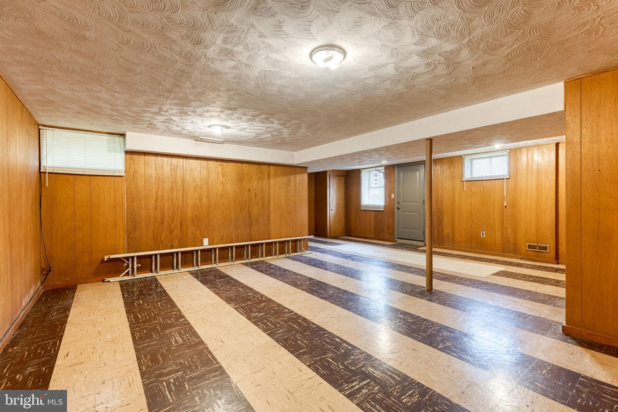 1302 Black Friars Road Baltimore, MD 21228 - Photo 28 of 38 a view of a room with wooden floor and windows