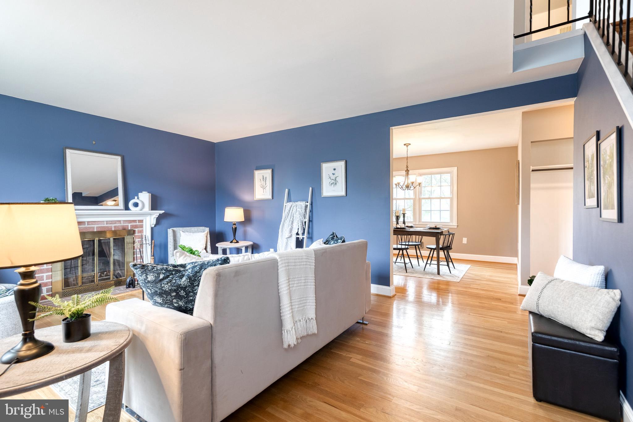1302 Black Friars Road Baltimore, MD 21228 - Photo 3 of 38 a living room with fireplace furniture and a wooden floor