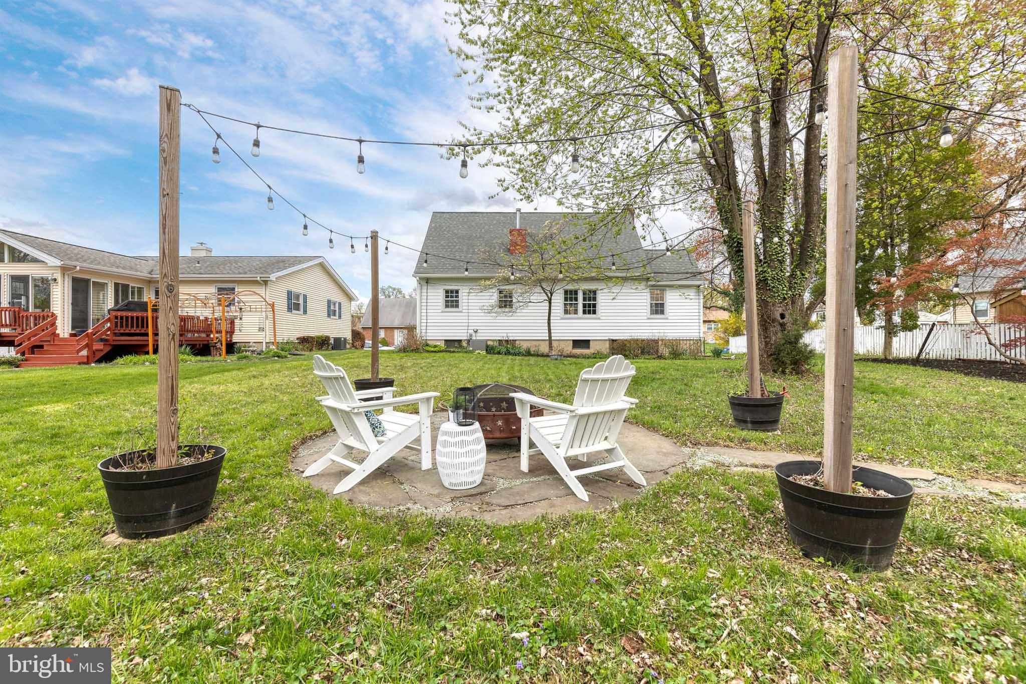 1302 Black Friars Road Baltimore, MD 21228 - Photo 32 of 38 a view of a house with backyard sitting area and garden