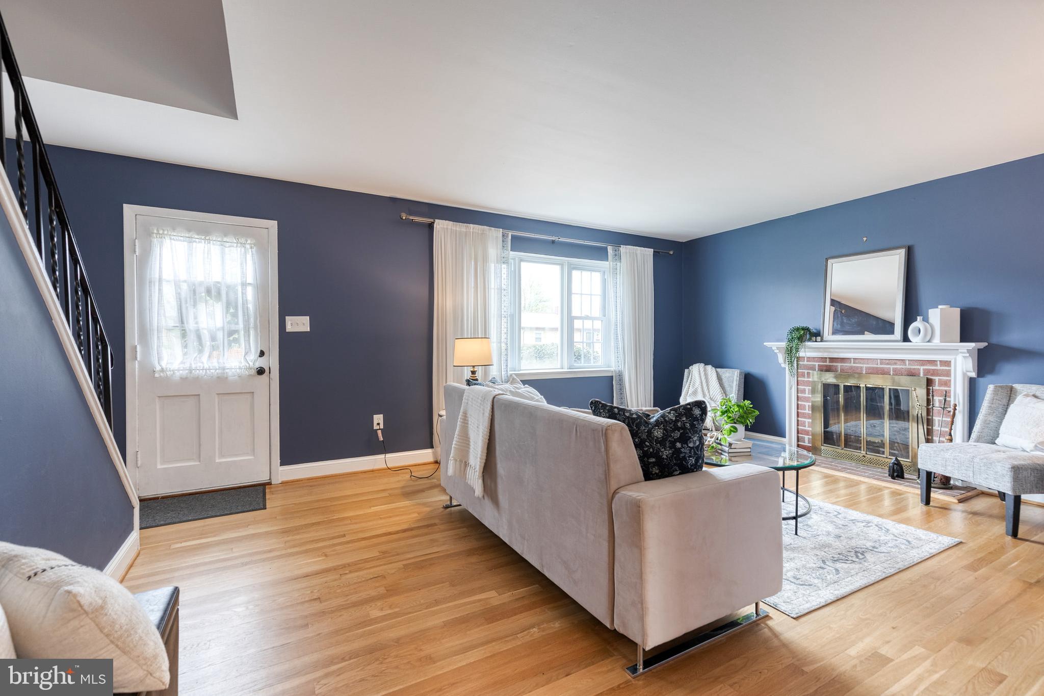 1302 Black Friars Road Baltimore, MD 21228 - Photo 5 of 38 a living room with furniture and a wooden floor