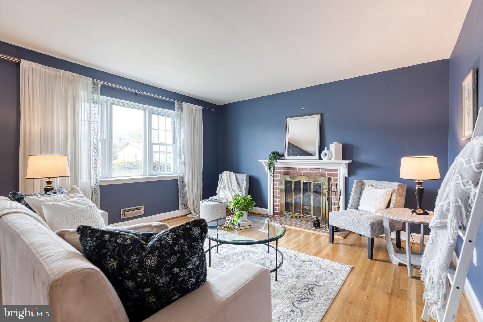 1302 Black Friars Road Baltimore, MD 21228 - Photo 6 of 38 a living room with furniture fireplace and a large window