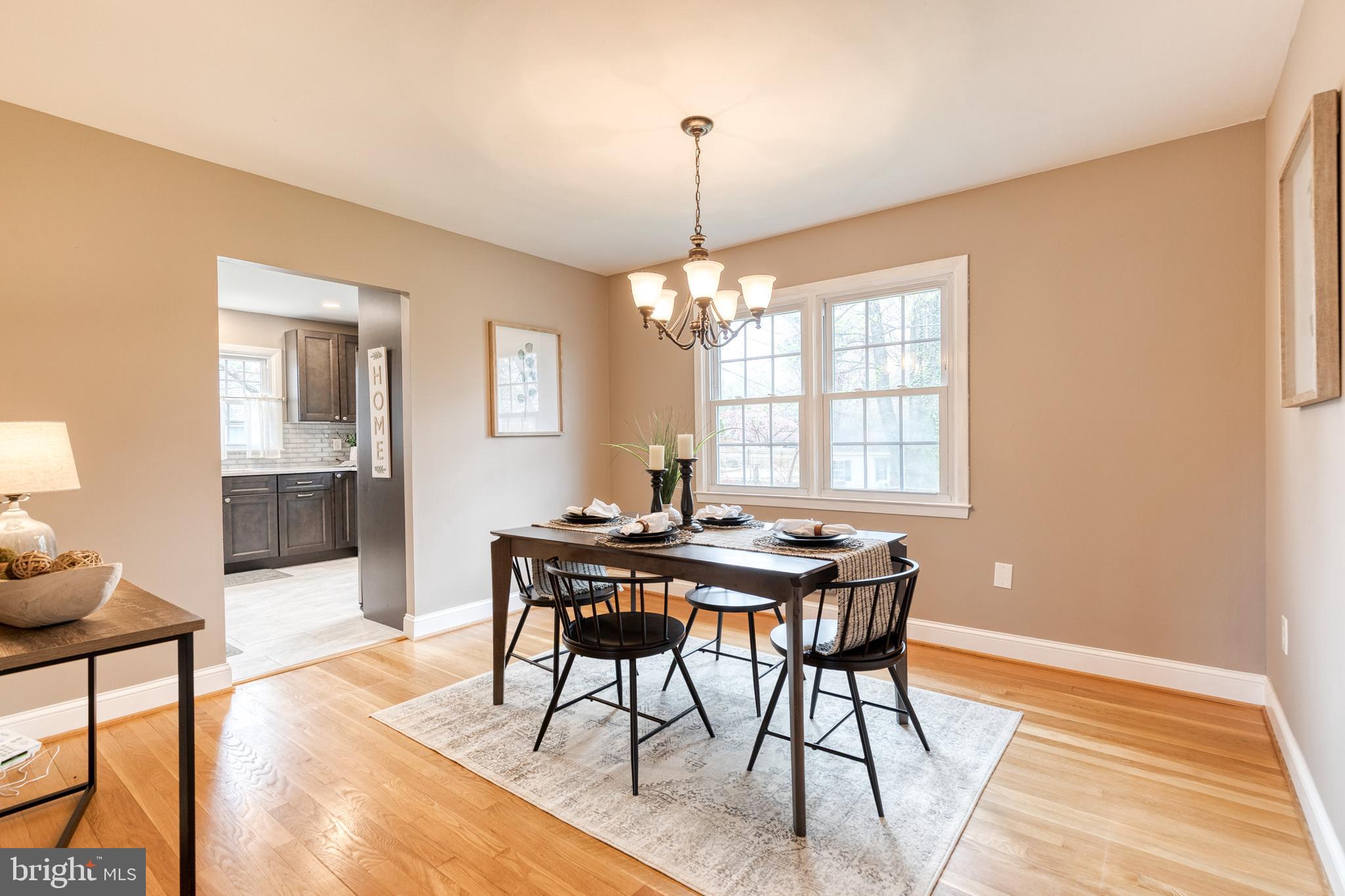 1302 Black Friars Road Baltimore, MD 21228 - Photo 7 of 38 a view of a dining room with furniture window and wooden floor