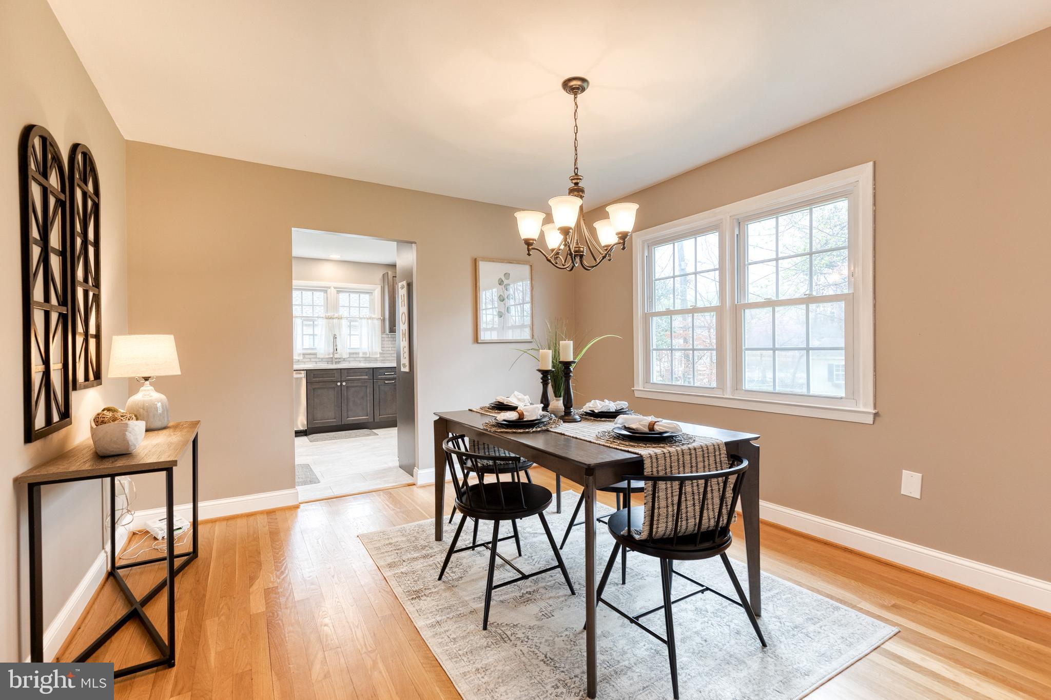 1302 Black Friars Road Baltimore, MD 21228 - Photo 8 of 38 a view of a dining room with furniture window and wooden floor