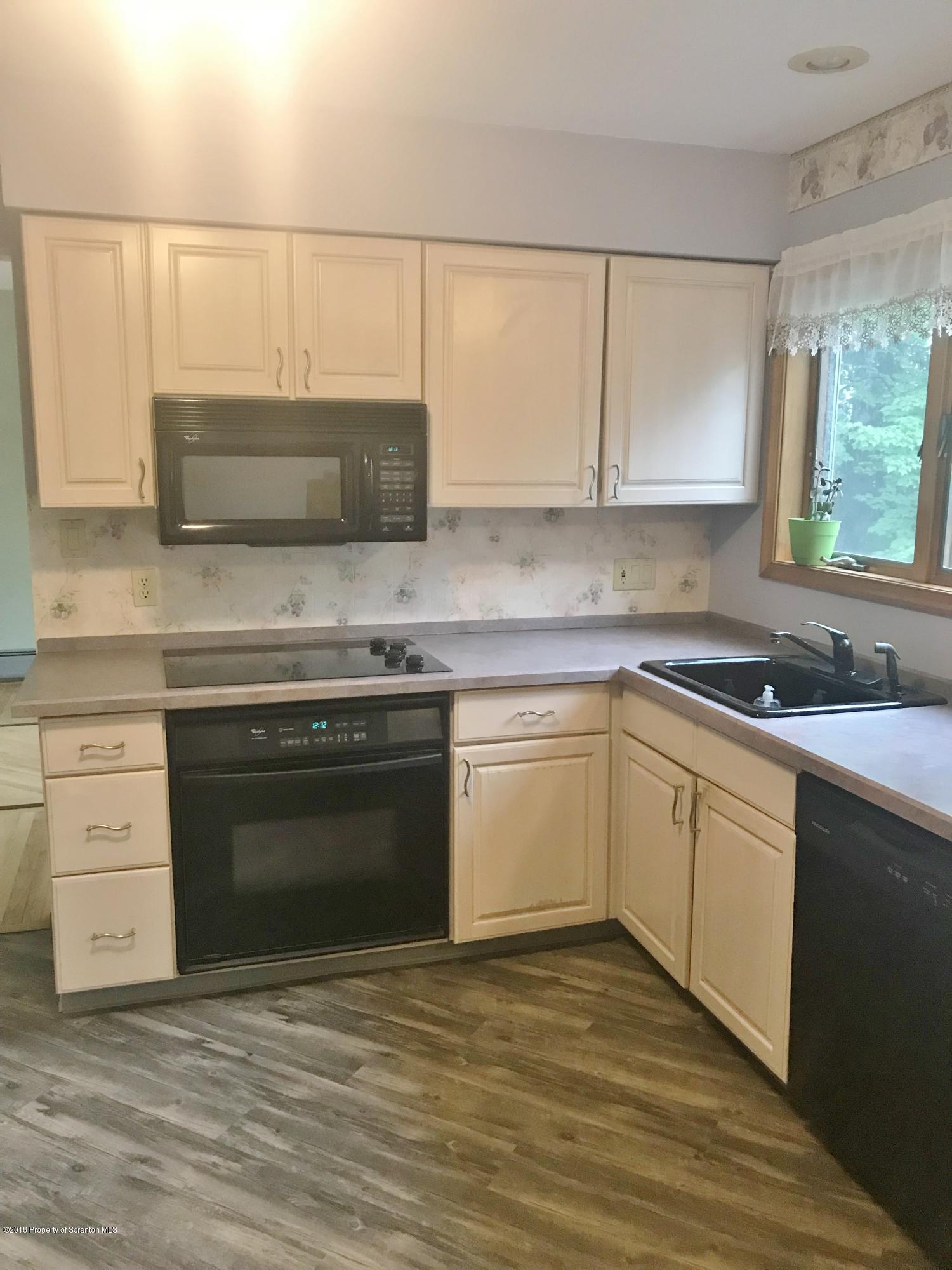 20 Ridgeview Drive Scranton, PA 18504 - Photo 11 of 39 a kitchen with a stove and a microwave