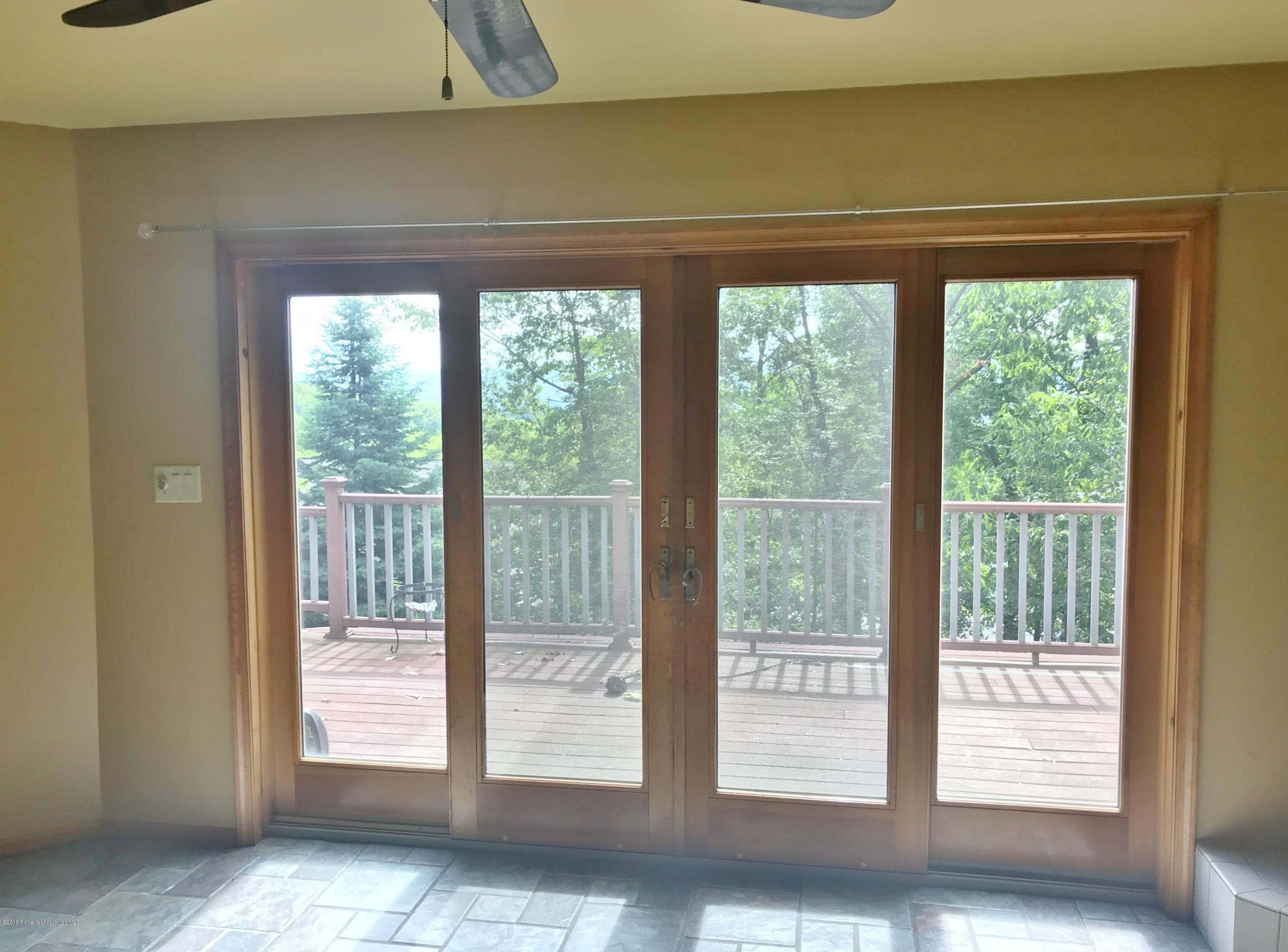 20 Ridgeview Drive Scranton, PA 18504 - Photo 13 of 39 a view of empty room with floor to ceiling window and an outdoor view