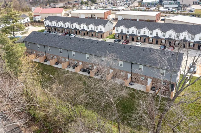 a roof deck view with tall buildings